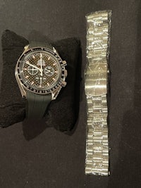 a watch with a black strap and a black strap