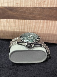 a watch on top of a cutting board